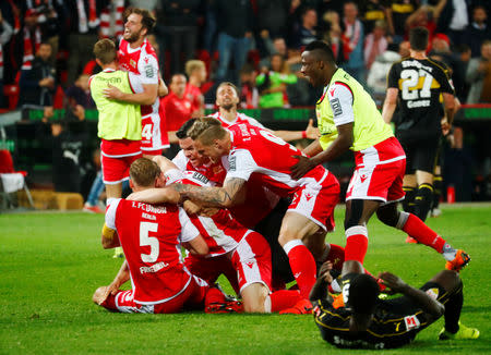Soccer Football - Bundesliga Relegation Playoff - Union Berlin v VfB Stuttgart - Stadion An der Alten Forsterei, Berlin, Germany - May 27, 2019 Union Berlin players celebrate after winning the match REUTERS/Annegret Hilse DFL regulations prohibit any use of photographs as image sequences and/or quasi-video