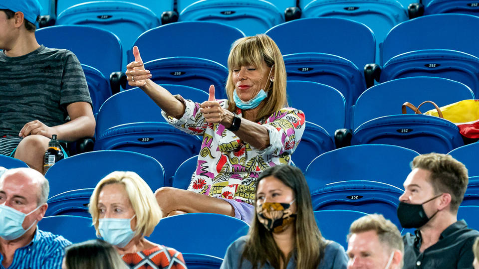 The woman, pictured here gesturing towards the players before being removed from the stands at the Australian Open.