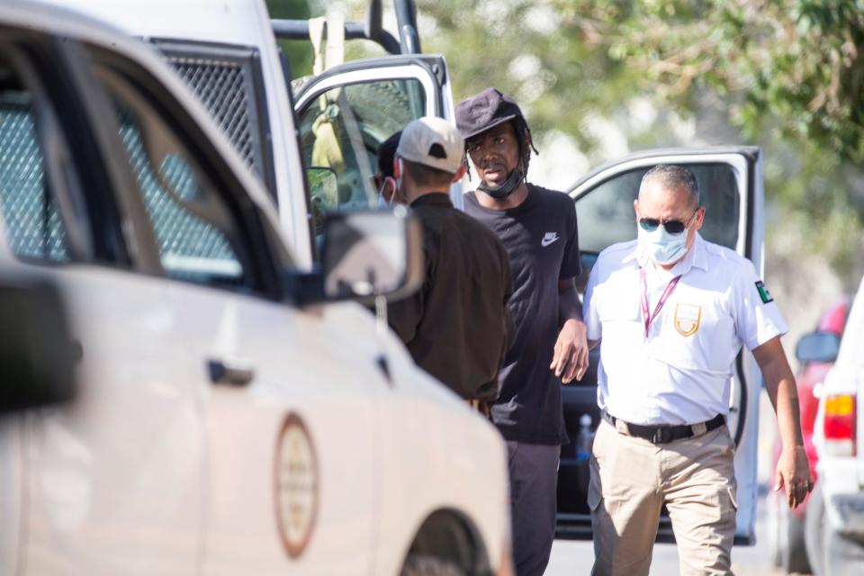 A Mexican state police detain a Haitian migrant in the the city of Ciudad Acuna during random street sweep on Sept. 20, 2021.