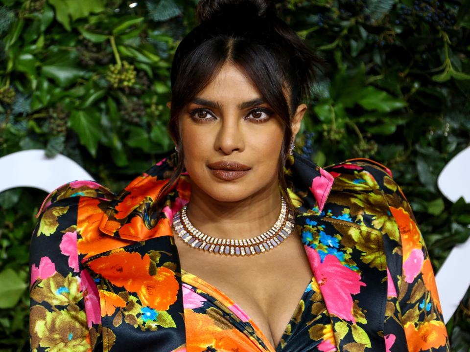 Priyanka Chopra Jonas poses for photographers upon arrival at the The Fashion Awards in London Monday, Nov. 29, 2021.