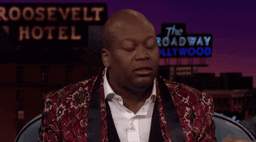 Titus Burgess acting shocked on "The Late Late Show With James Corden"