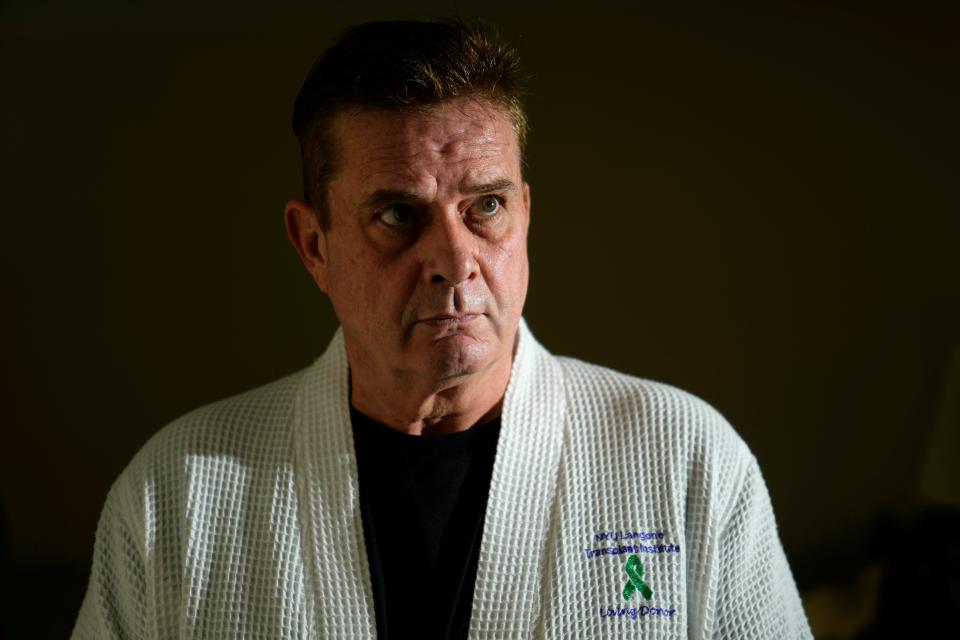 Kevin Kiernan, of Waldwick, poses for a photograph with a robe he got from NYU Langone, after donating a kidney. Kiernan claims he has had a slew of medical issues since donating the kidney. Monday, August 21, 2023