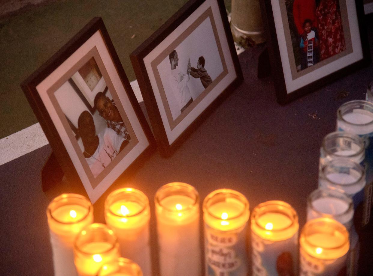 Candles and photos are set out for a vigil for Mark Scott at Swenson Park in Stockton. Scott, a paraprofessional at Pulliam Elementary School and a baseball coach for Edison High School, was shot and killed at 1:30 p.m. on Feb. 11 in the 8000 block of North El Dorado Street in Stockton.