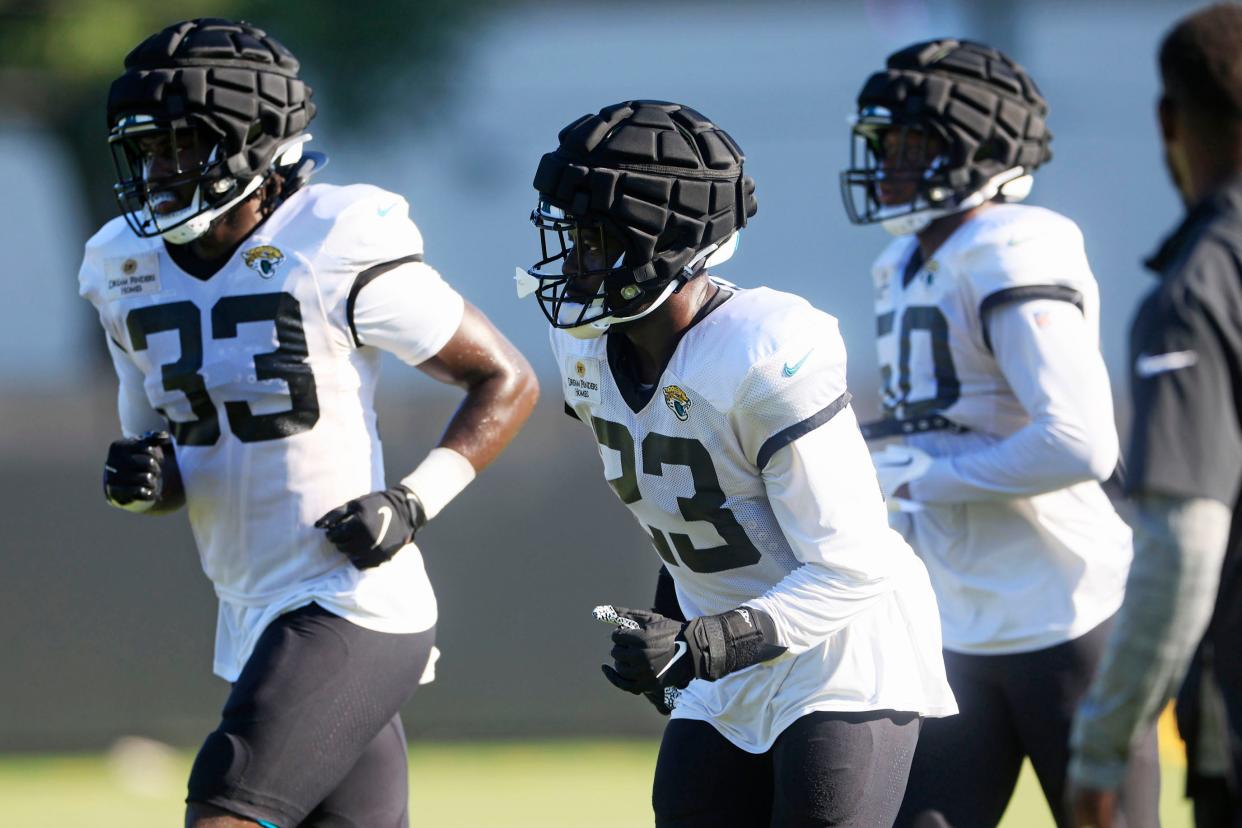 Jacksonville Jaguars linebacker Foyesade Oluokun (23), center, linebacker Devin Lloyd (33), left, and linebacker Shaquille Quarterman (50) run to huddle during training camp Monday, Aug. 7, 2023 at Miller Electric Center at EverBank Stadium in Jacksonville, Fla. This was the 11th day of training camp. 