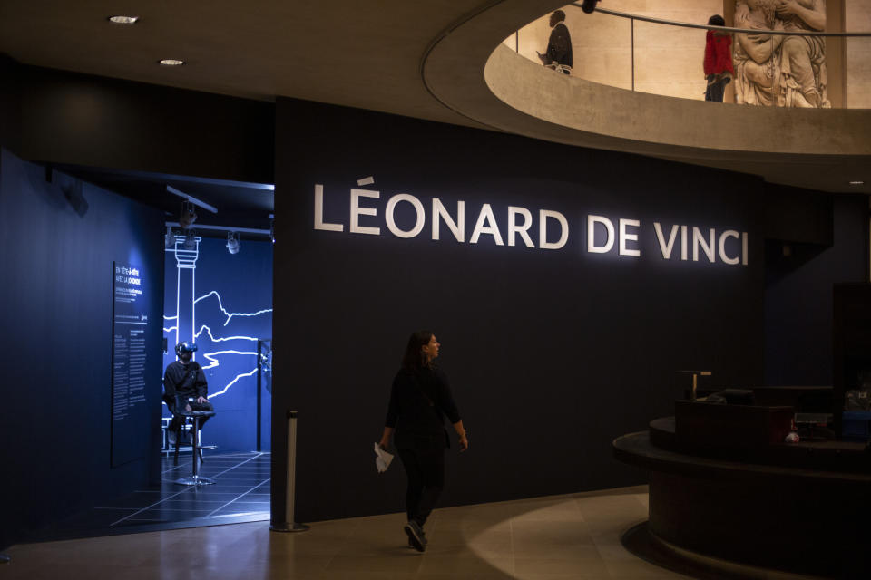 A journalist experiences the virtual reality performance during the visit of Leonardo da Vinci exhibition at the Louvre museum Sunday, Oct. 20, 2019, in Paris. A unique group of artworks is displayed at the Louvre museum in addition to its collection of paintings and drawings by the Italian master. The exhibition opens to the public on Oct.24, 2019. (AP Photo/Rafael Yaghobzadeh)