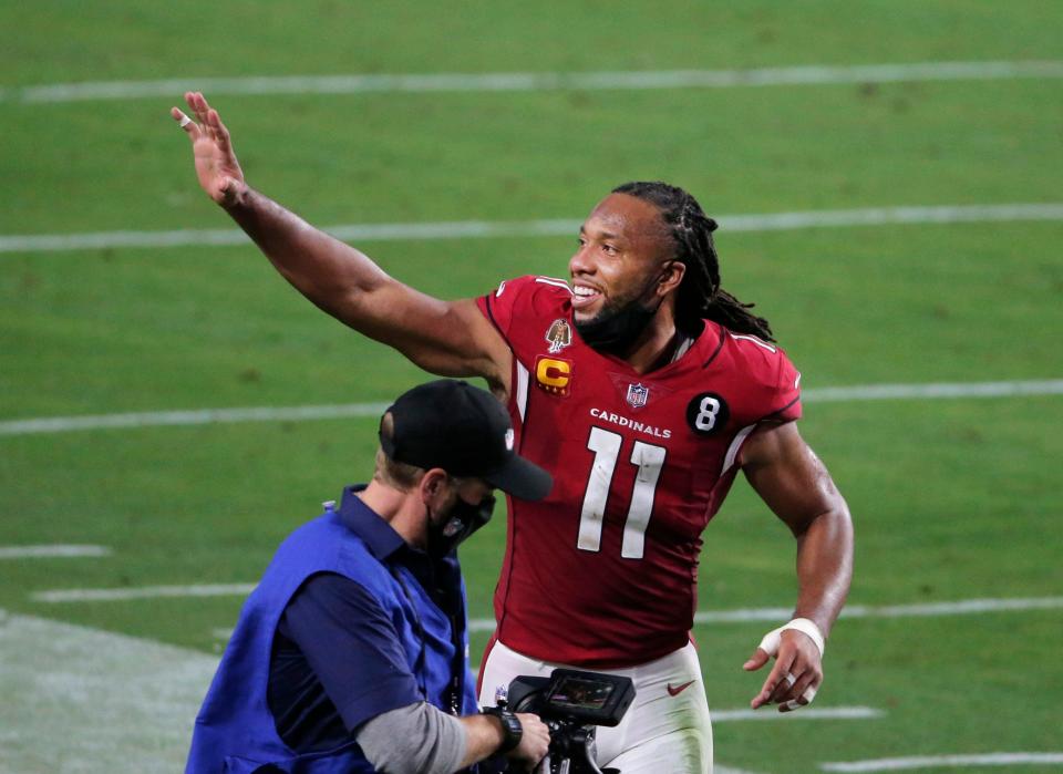 Dec 26, 2020; Glendale, AZ, USA;  Arizona Cardinals wide receiver Larry Fitzgerald (11) leaves the field after finishing the last home game of the season at State Farm Stadium.