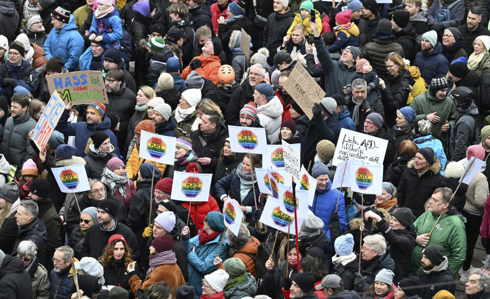 Thousands gather to demonstrate against right-wing extremism, in the market square in Bremen, Germany, Sunday Jan. 21, 2024. Thousands of people are expected to protest the far right in cities across Germany. They come in the wake of a report that right-wing extremists recently met to discuss the deportation of millions of immigrants, including some with German citizenship. (Carmen Jaspersen/dpa via AP)