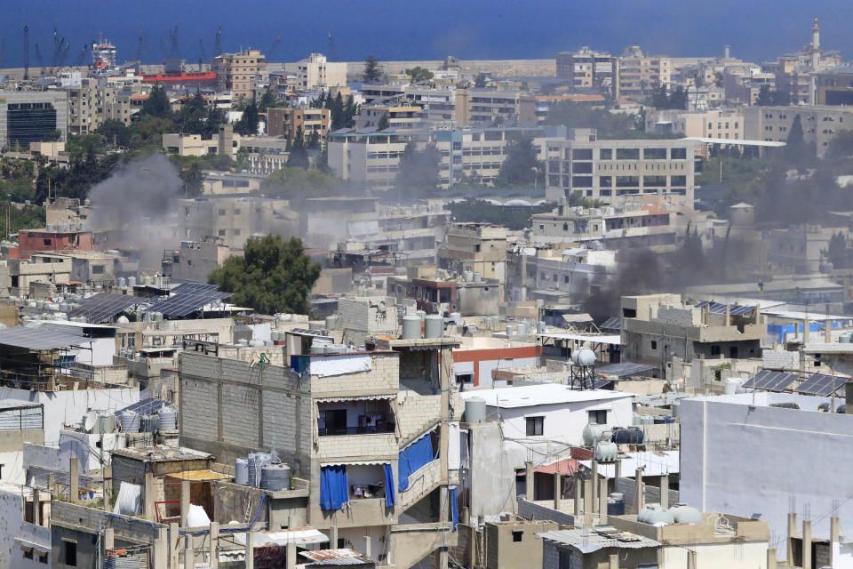 Smoke rises during a third day of clashes that erupted between members of Palestinian President Mahmoud Abbas' Fatah group and Islamist factions in the Palestinian refugee camp of Ein el-Hilweh near the southern port city of Sidon, Lebanon, Monday, July 31, 2023. (AP Photo/Mohammad Zaatari)