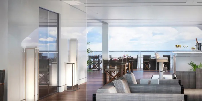 A rendering of the marina terrace with views of the ocean, lounge seating on the Ritz-Carlton Evrima.