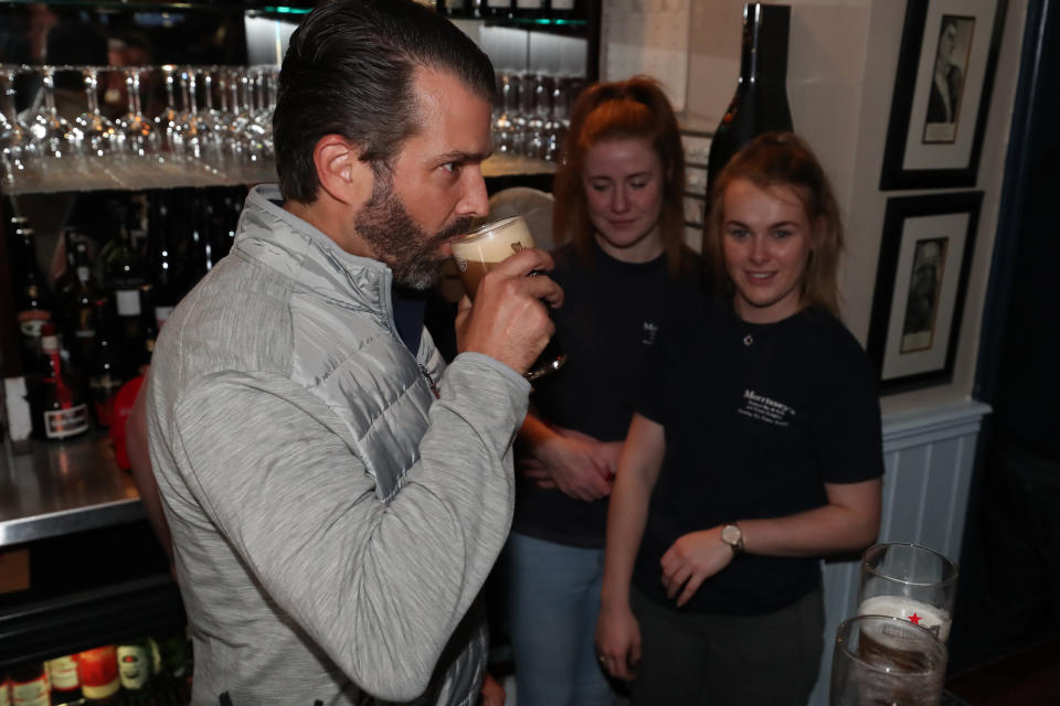 Donald Trump Jr., the son of US President Donald Trump, pours drinks and meets locals in the village of Doonbeg in Co Clare, on the first day of US President Donald Trump's visit to the Republic of Ireland. (Photo by Niall Carson/PA Images via Getty Images)