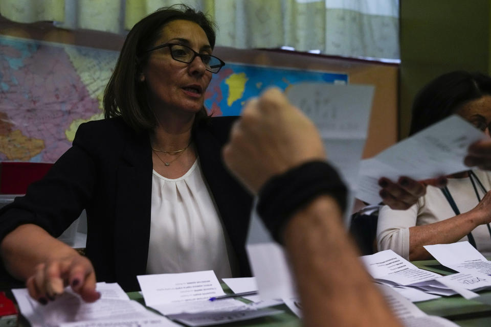 Election representatives count the ballots at a polling station in Athens, Greece, Sunday, May 21, 2023. Exit polls in Greece's parliamentary elections show Prime Minister Kyriakos Mitsotakis' conservative party is in the lead but is unlikely to win enough seats in parliament to form a government outright. (AP Photo/Thanassis Stavrakis)