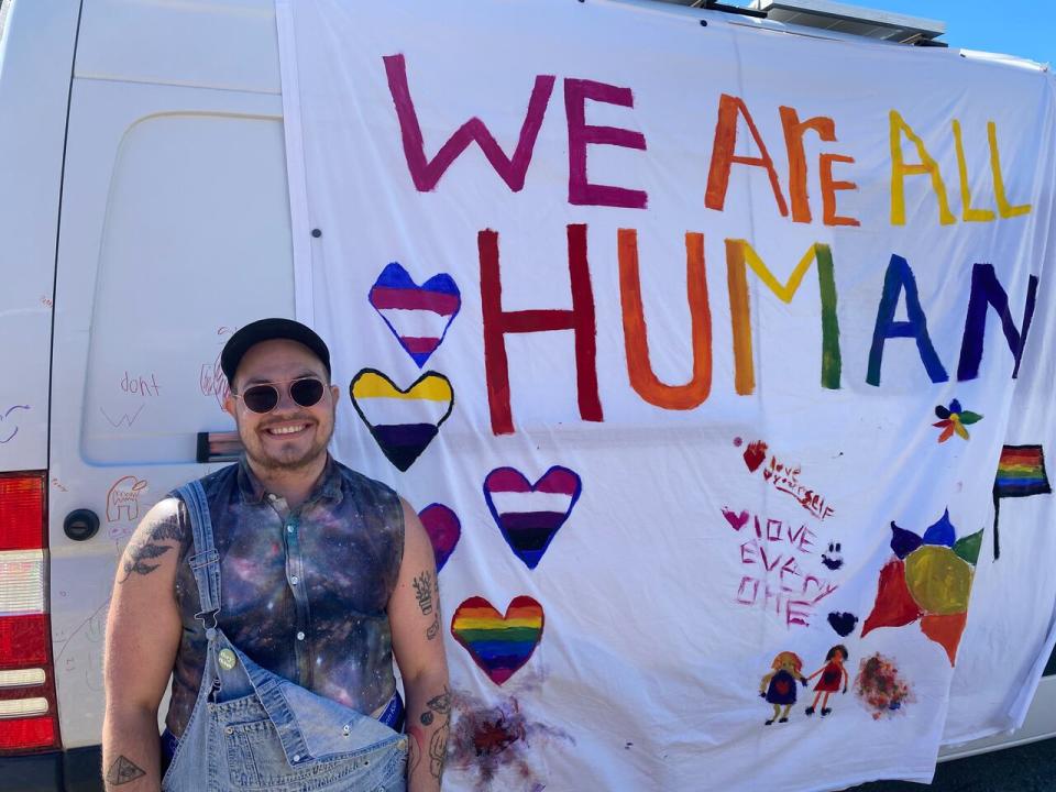 Finley Parkes is with Queer Yukon. They said events like the Mayo parade create an opportunity to educate residents about the 2SLGBTQ+ community. (Chris MacIntyre/CBC)