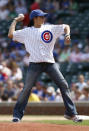 IRL driver Danica Patrick throws out the ceremonial first pitch before the baseball game between the Pittsburgh Pirates and Chicago Cubs at Wrigley Field, Thursday, Sept. 7, 2006 in Chicago.(AP Photo/Nam Y. Huh)