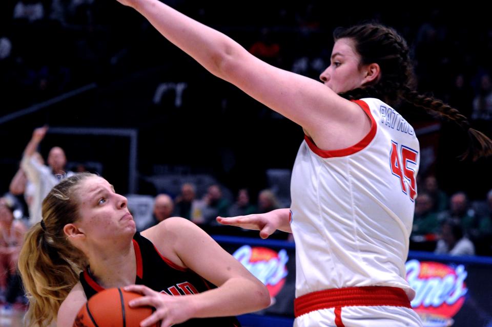 Hiland Joplin Yoder is fouled on this shot attempt by Tri-Village Kynnedi Hager.