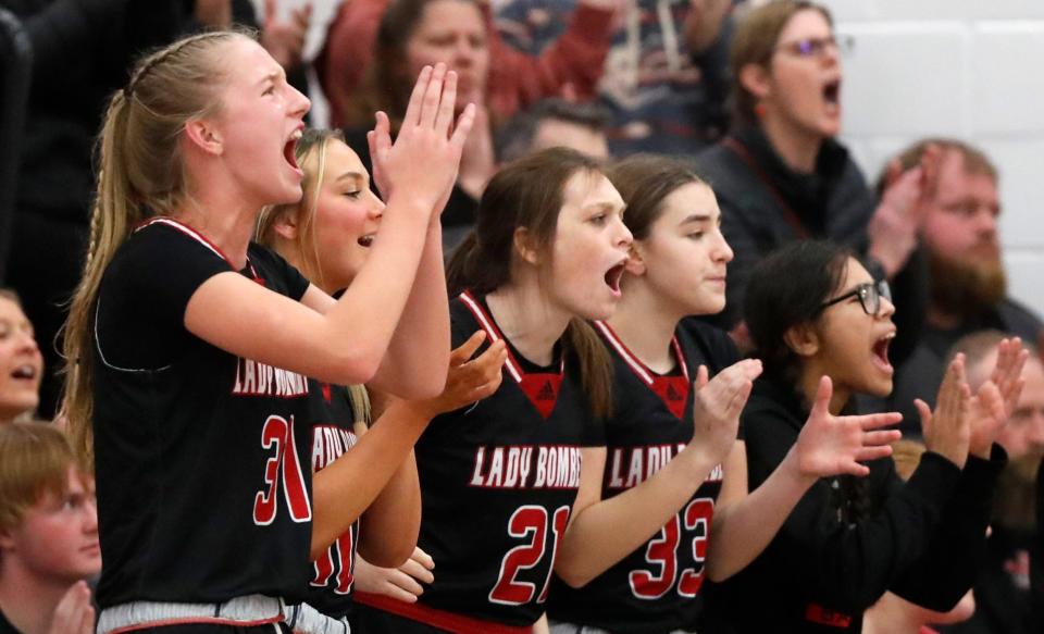 The Rensselaer Central Bombers bench cheers during the IHSAA basketball doubleheader /W?/, Thursday, Jan. 11, 2024, at West Lafayette High School in West Lafayette, Ind.