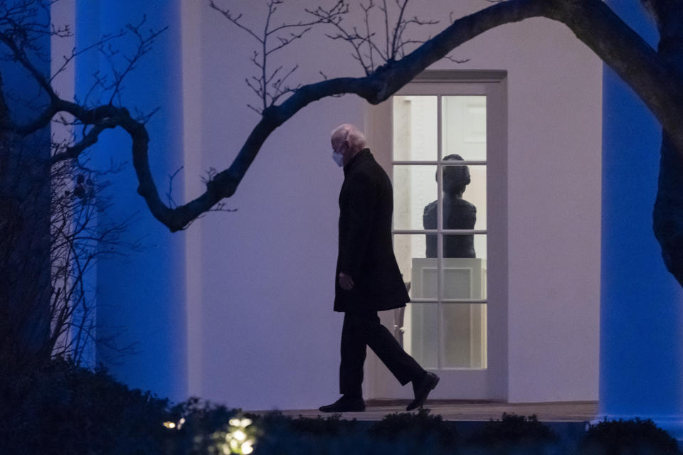 President Joe Biden walks on the Colonnade to Marine One for departure from the South Lawn of the White House, Friday, Feb. 12, 2021, in Washington. Biden is en route to Camp David. (AP Photo/Alex Brandon)