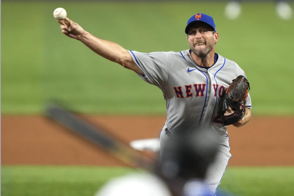 New York Mets starting pitcher Max Scherzer throws to Miami Marlins' Jorge Soler during the second inning of an opening day baseball game, Thursday, March 30, 2023, in Miami. (AP Photo/Lynne Sladky)