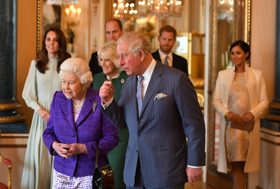 Catherine, Duchess of Cambridge, Camilla, Duchess of Cornwall, Prince William, Duke of Cambridge, Prince Harry, Duke of Sussex, Queen Elizabeth II, Prince Charles, Prince of Wales and Meghan, Duchess of Sussex attend a reception to mark the 50th anniversary of the investiture of the Prince of Wales at Buckingham Palace on March 5 in London. (Photo: WPA Pool via Getty Images)