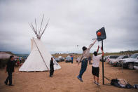 <p>Native Americans play basketball in an encampment where demonstrators trying to stop the Dakota Access oil pipeline have gathered near the Standing Rock Sioux reservation in Cannon Ball, N.D., on Sept. 5, 2016. (Photo: Andrew Cullen/Reuters) </p>