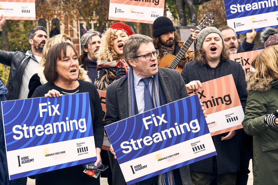 Labour MP Kevin Brennan with campaigners outside Parliament (Jonathan Stewart/PA)