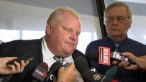 Toronto Mayor Rob Ford speaks to reporters at City Hall following a deal approved by city council to sell Toronto's share of Enwave Energy.