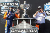 Scott Dixon, left, and Chip Ganassi celebrate after winning the NTT IndyCar Series Championship following an IndyCar auto race Sunday, Oct. 25, 2020, in St. Petersburg, Fla. (AP Photo/Mike Carlson)