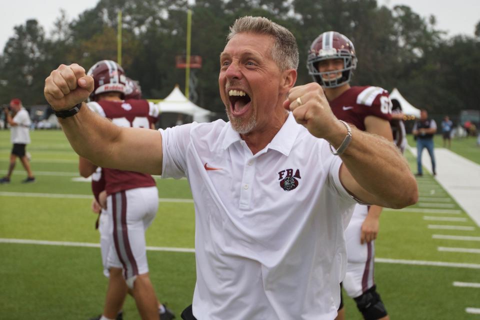 First Baptist Academy coach Billy Sparacio celebrates after his team defeated Trinity Catholic in the Class Suburban 1 state championship football game, 21-3, on Dec. 10, 2022, at Gene Cox Stadium.