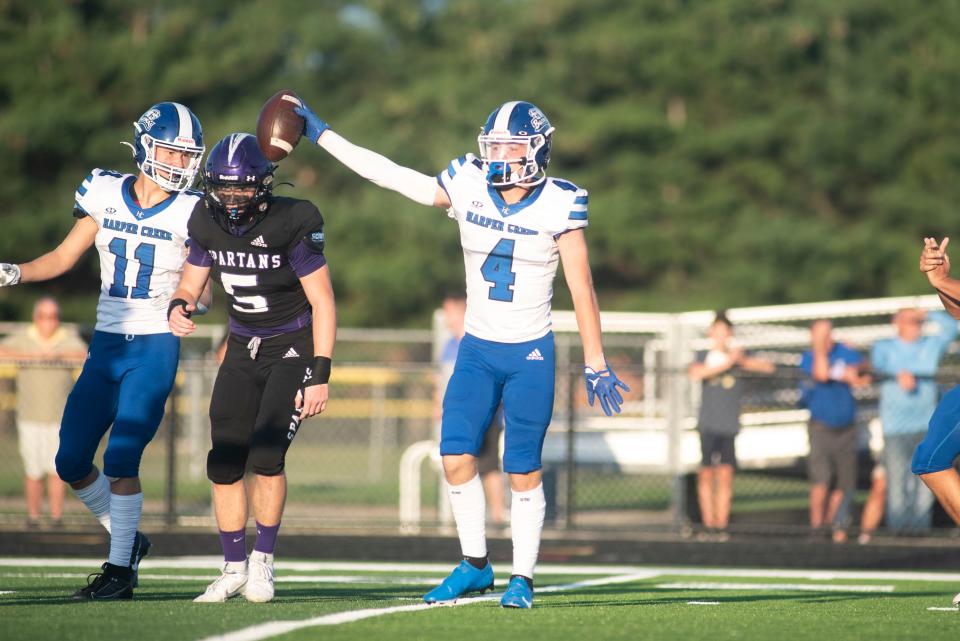 Harper Creek junior Nate Jackson celebrates a play during the season opening game at Lakeview High School on Friday, Aug. 25, 2023.