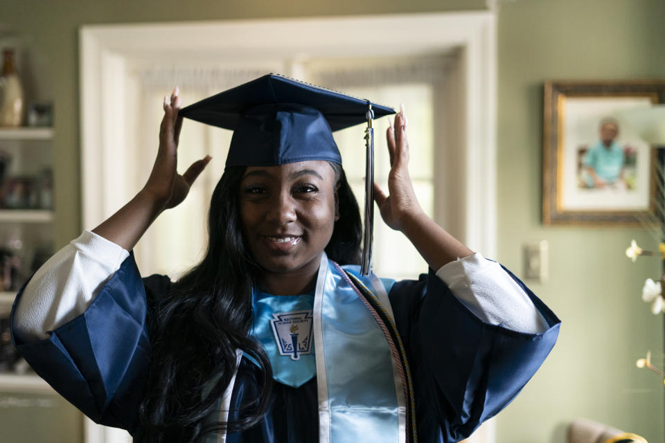 Nylla Miller prepares for her high school graduation ceremony at her home in Aldan, Pa., Thursday, June 15, 2023. (AP Photo/Matt Rourke)