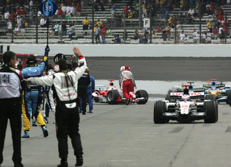 The remaining 14 cars – using unsafe Michelin tyres – entered the pits (Getty)