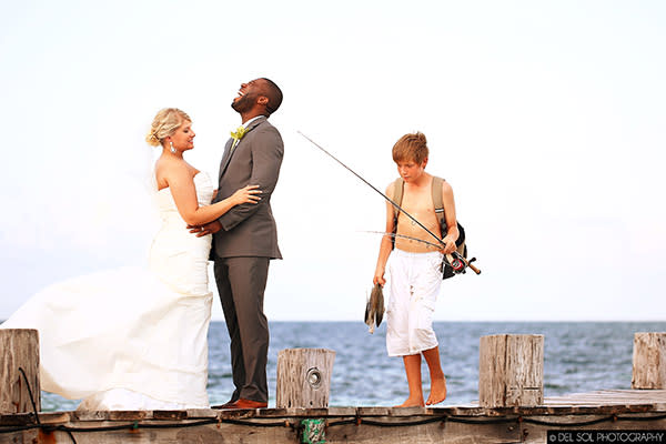 <div class="caption-credit">Photo by: del Sol Photography</div><div class="caption-title">Reel 'Em In</div><p> Catch of the day! A photobomb is a small price to pay for having locally-sourced seafood on your wedding menu. </p> <p> <i>Have a photobomb of your own that you'd like to share? Upload your pic to</i> <i><span>BG's Facebook page</span> or</i><i><span>submit it to us via Instagram</span> (be sure to include the hashtag #bgphotobombs) and we may add it to our list!</i> </p>