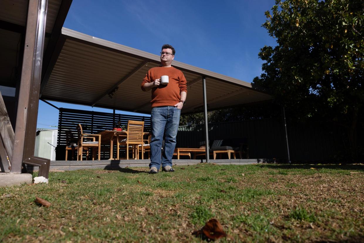 <span>Ben Engel says he complained to the retailer after his son stepped on a piece of glass after he spread loose organic top dressing on his lawn.</span><span>Photograph: Carly Earl</span>