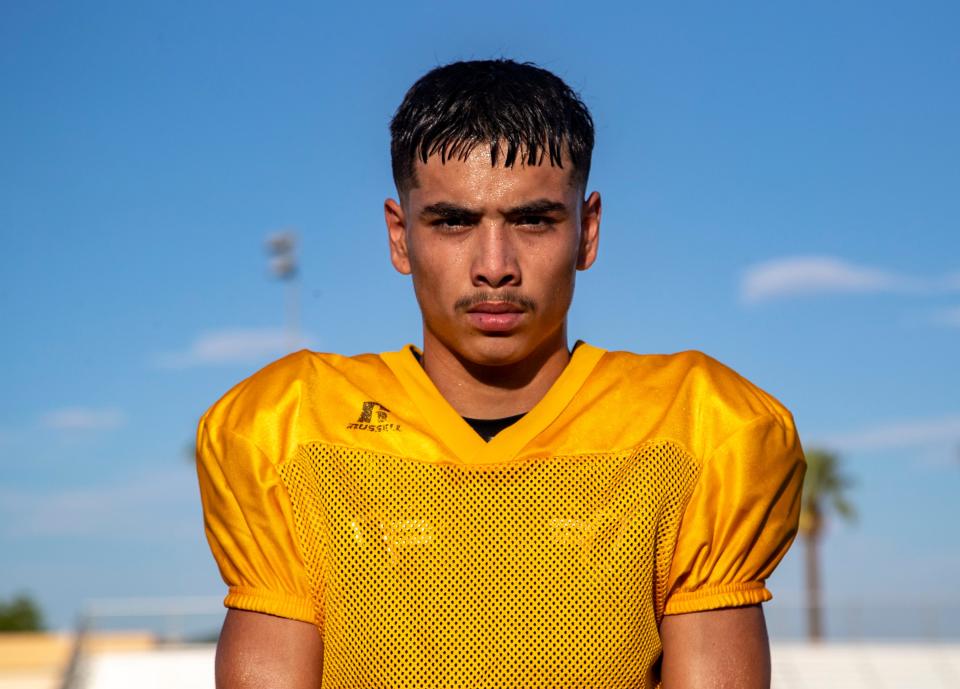 Coachella ValleyÕs Aaron Ramirez poses for a photo during a football practice at Coachella Valley High School in Coachella, Calif., Wednesday, Aug. 3, 2022. 