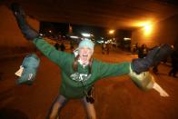 A Saskatchewan Roughriders fan celebrates after his team beat the Hamilton Tiger-Cats in the CFL's 101st Grey Cup championship football game in Regina, Saskatchewan November 24, 2013. REUTERS/David Stobbe (CANADA - Tags: SPORT FOOTBALL)