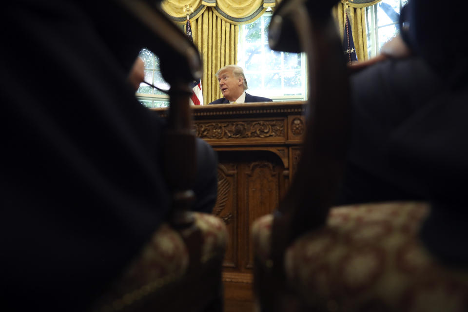 President Donald Trump listens as he meets with Chinese Vice Premier Liu He in the Oval Office of the White House in Washington, Friday, Oct. 11, 2019. (AP Photo/Andrew Harnik)