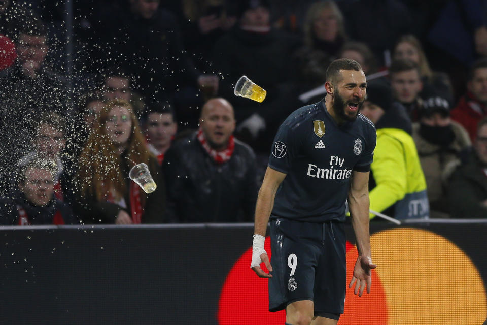 Real forward Karim Benzema celebrates after scoring his side's opening goal during the first leg, round of sixteen, Champions League soccer match between Ajax and Real Madrid at the Johan Cruyff ArenA in Amsterdam, Netherlands, Wednesday Feb. 13, 2019. (AP Photo/Peter Dejong)