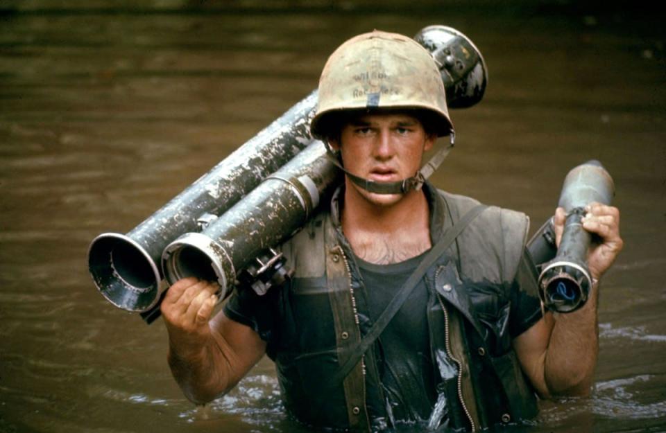 U.S. Marine in Vietnam, October 1966. (Larry Burrows—Time & Life Pictures/Getty Images) <br> <br> <a href="http://life.time.com/history/life-behind-the-picture-larry-burrows-reaching-out-1966/#1" rel="nofollow noopener" target="_blank" data-ylk="slk:Click here to see the full collection at LIFE.com;elm:context_link;itc:0;sec:content-canvas" class="link ">Click here to see the full collection at LIFE.com</a>