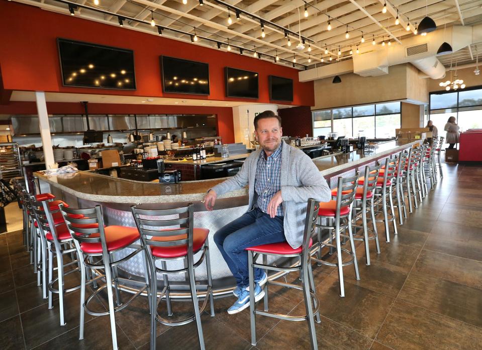 Charles Belanger is the district manager of Evviva Trattoria at The Ridge Marketplace in Rochester.