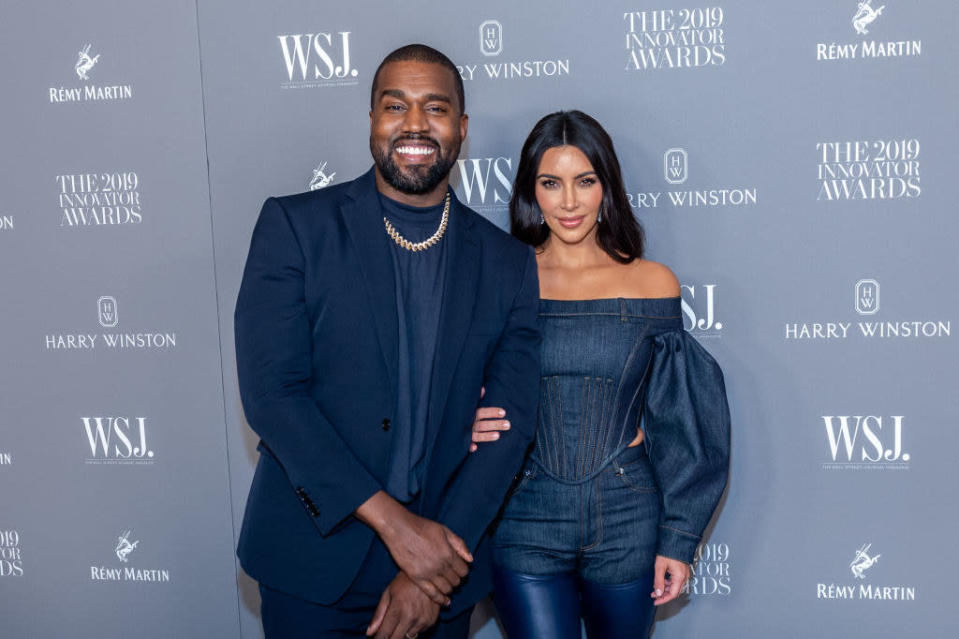 Ye (L) and Kim (R) at the WSJ Awards in 2019, they&#39;re matching in navy blue ensembles