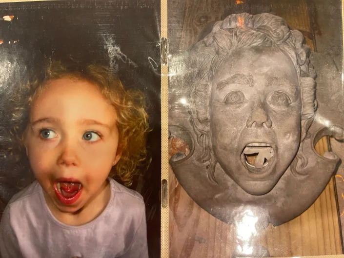 Sculpture modelled after a little girl's face.