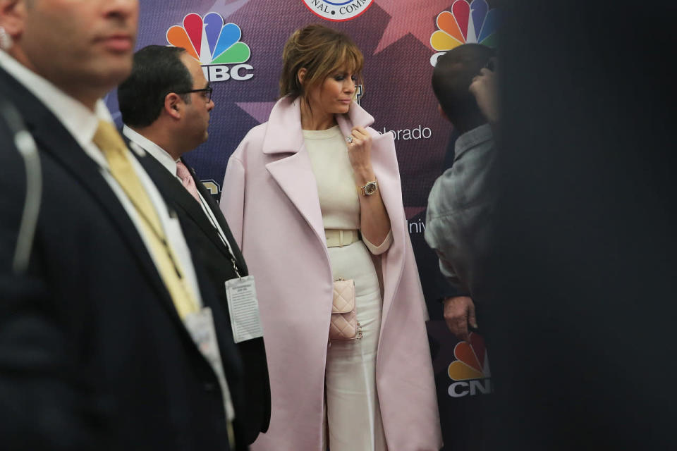 Melania Trump wearing a pink coat as a cape in 2015