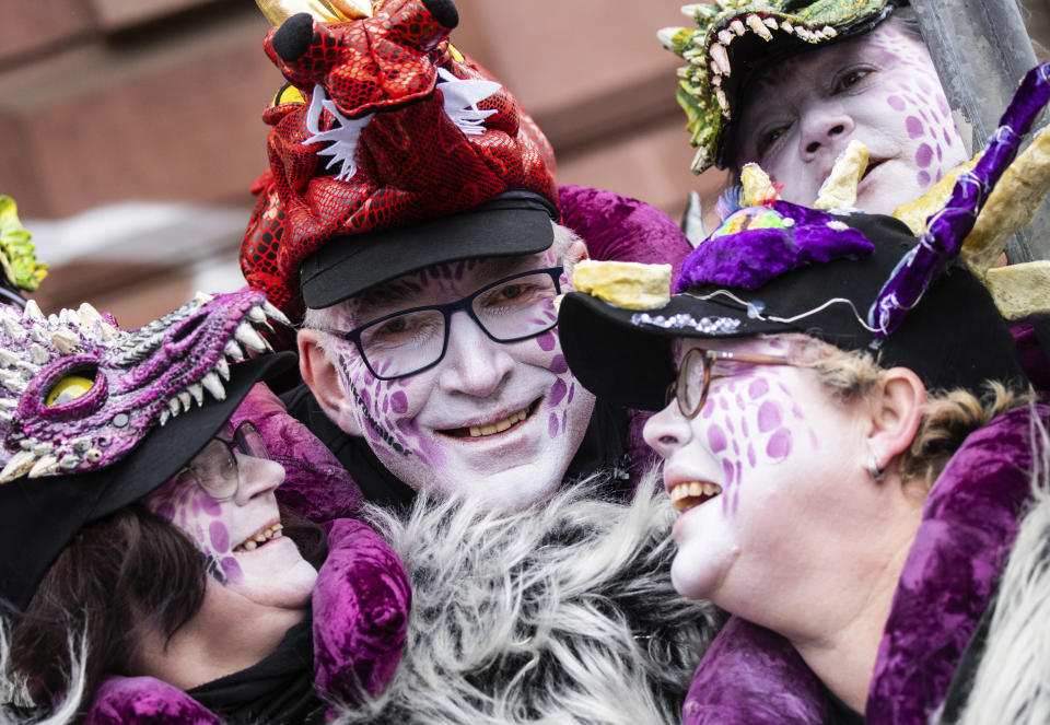 The "Stallkrawaller Bad Vilbel" stand together before the start the carnival parade in Frankfurt, Germany, Feb. 23, 2020. (Andreas Arnold/dpa via AP)