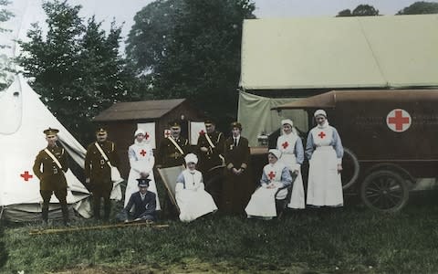 Members of the Voluntary Aid Detachment at a camp - Credit: Reproduced with the permission of the British Red Cross Museum and Archives