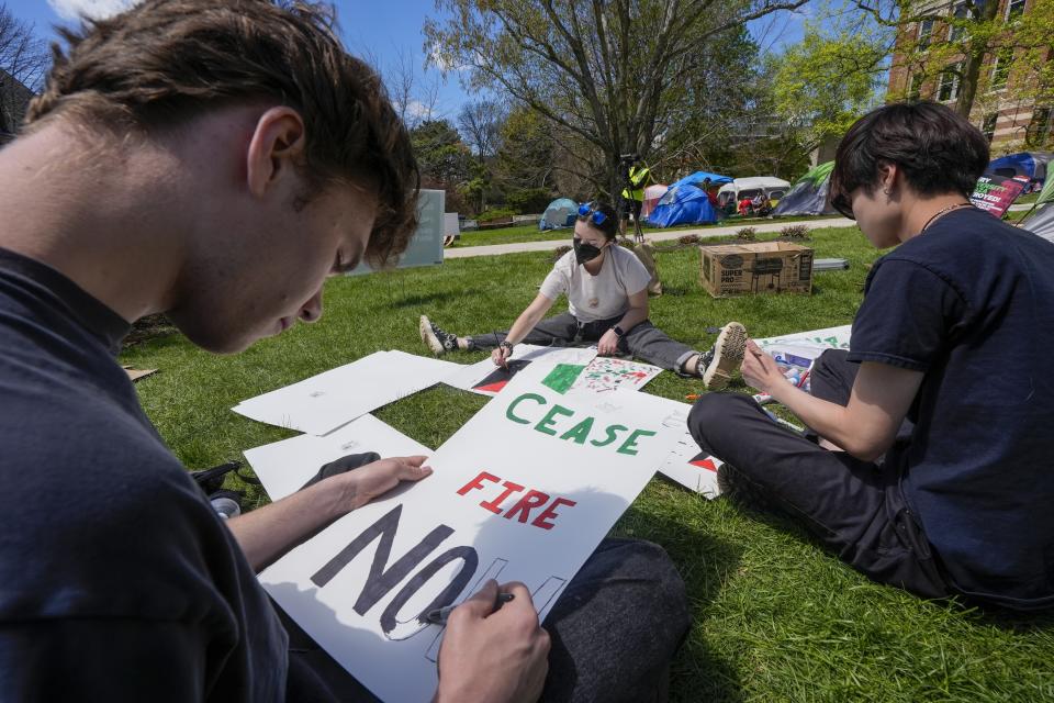 Protesters make signs in an encampment area on the University of Wisconsin-Milwaukee campus Tuesday, April 30, 2024, in Milwaukee. The Pro-Palestinian rally is calling for the university to cut ties with Israel and for peace in Gaza. (AP Photo/Morry Gash)