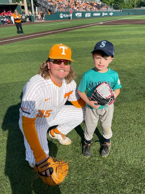 Tennessee pitcher Kirby Connell poses with Merrick Hermann, a 5-year-old who has recovered from immune thrombocytopenia, a disorder that reduces platelet counts. Hermann threw out the first pitch before the Vols' game against Belmont at Lindsey Nelson Stadium on May 17.