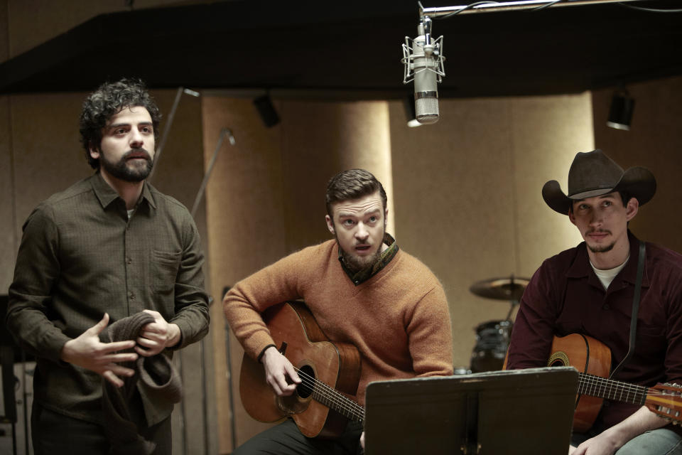 FILE - This file film image released by CBS FIlms shows, from left, Oscar Isaac, Justin Timberlake and Adam Driver in a scene from "Inside Llewyn Davis." In the Coen brothers film, Timberlake plays a supporting role as a cheery, sweater-wearing 1960s folk musician. But he also collaborated with producer T Bone Burnett on the movie’s memorable period songs and helped shape the film’s most unforgettable and comic tune, “Please Mr. Kennedy.” (AP Photo/CBS FIlms, Alison Rosa, File)