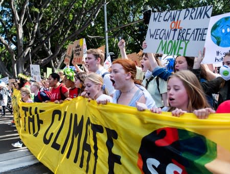 People take part in a protest to call for action on climate change in Sydney