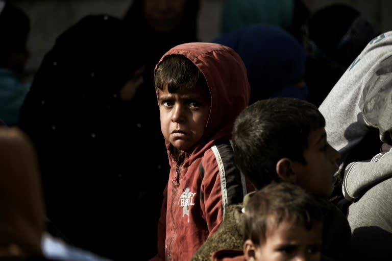 A displaced Iraqi boy cries as he flees the city of Mosul while government forces battle Islamic State group jihadists on February 28, 2017