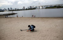 Visitors stroll at Odaiba Marine Park, the venue for Marathon Swimming and Triathlon events during the Tokyo 2020 Games, in Tokyo, Japan October 4, 2017. REUTERS/Issei Kato