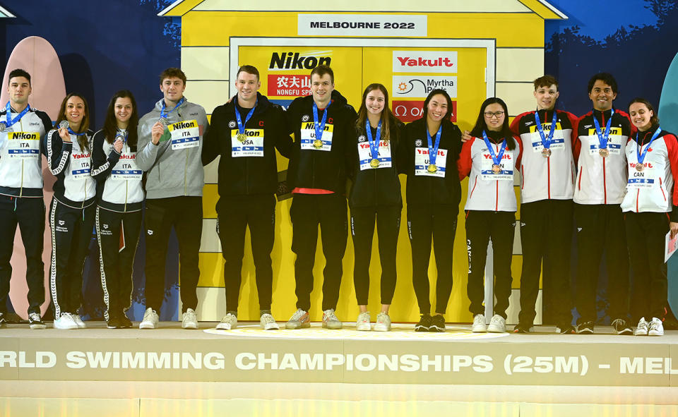 The medallists, pictured here on the podium after the 4x50m mixed relay at the short course world swimming championships.
